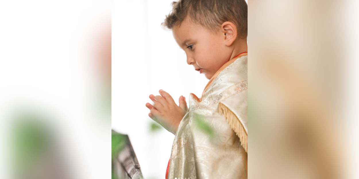 A five-year-old American boy dreams of becoming a priest